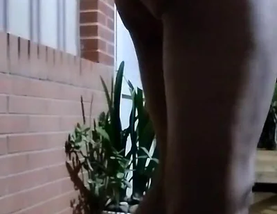 In the Doorway in a Thong and with an Anal Plug