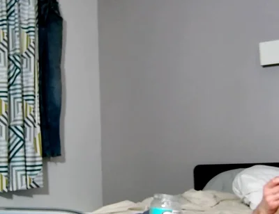 On Bed Laying Down with Socks and Beater on