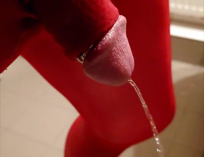 Pissing at Home in Red Legging with Penis Sleeve