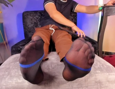 College Teacher Relaxes on the Couch at Home with His Feet on the Furniture so He Can Adore Them