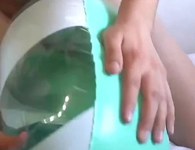 Playing with a Green and White Swimring