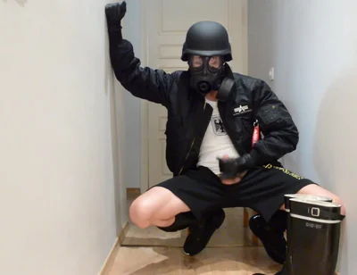 Gas masked guy cums on his rubber boots