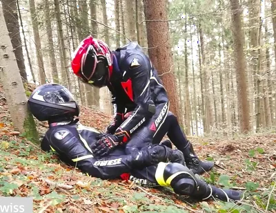 German dainese bikers having fun in the wood