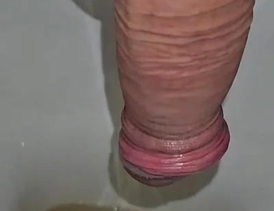 Male Peeing Into the Toilet