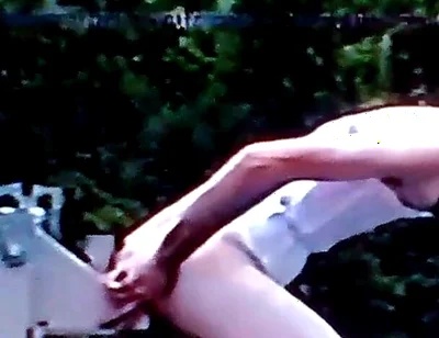 Crossdresser Riding a Giant Dildo on a Roof Top