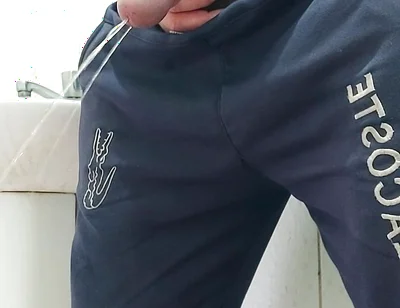 A Well-endowed Brazilian Man Urinating and Showing His Thick Penis to His Female Friends.