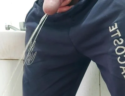 A Well-endowed Brazilian Man Urinating and Showing His Thick Penis to His Female Friends.