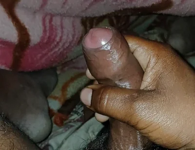 Big Boss massaging penis oil under the blanket