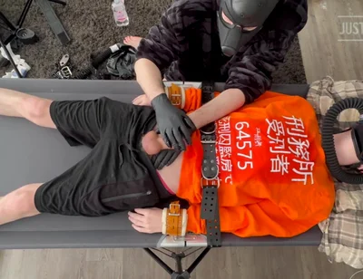 Gas Mask Boy Strapped Down and Edged