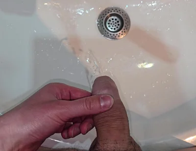 Pissing to the Bathroom Sink