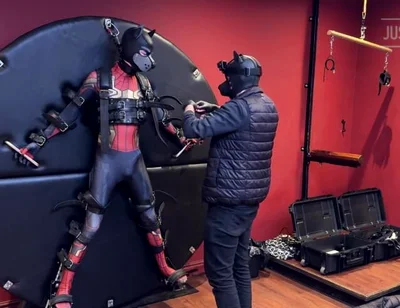 Pup Twink Dressed as Spider-man Strapped to the Bondage Wheel and Milked