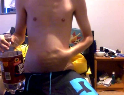 Young Guy Fills His Stomach with Water