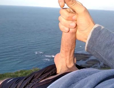 Huge Dirty Cock Gets Handjob on the Beach and Squirts a Lot of Thick Sperm in Front of the Beach