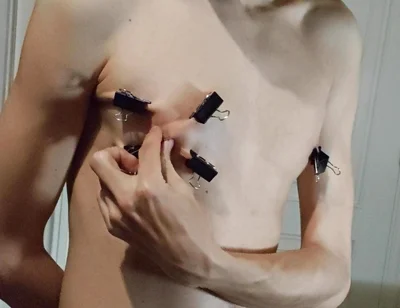 Twink Playing with Binder Clips