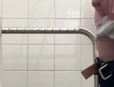 In the Hospital Toilets, a Guy Pisses Into a Cup for a Urine Sample, Then Gets Horny, Jerks-off and Cums