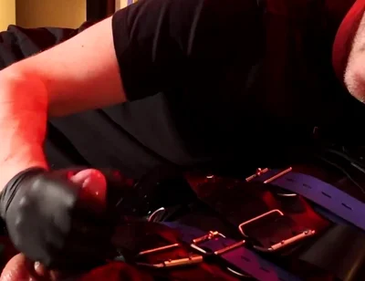 Edging the Boy in Leather Bondage but He Is Not Allowed to Orgasm