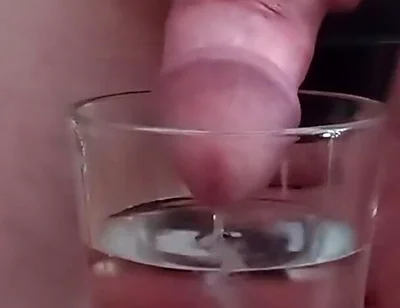 Cumming in a glass of hot water