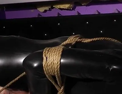 Roped in Latex: Zeus Struggles to Break Free
