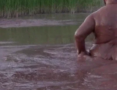 Mud Bath in Deep Quarry Mud Pond