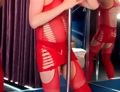 She Dances in a Red Bodysuit, as if Someone Is Going to Take Her Right at the Pylon