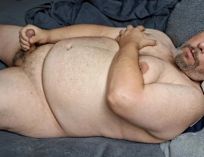 Chubby Guy Lays in Bed and Cums