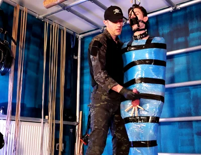 Twink Slave Bound in Pallet Wrap for Orgasm Control