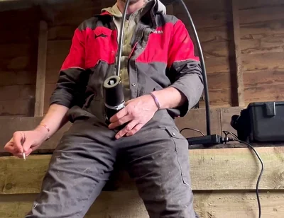 Farmer Smokes and Milks Himself with the Milking Machine