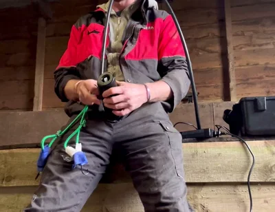 Farmer Smokes and Milks Himself with the Milking Machine