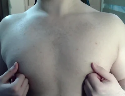 Muscular jock plays with his nipples on cam