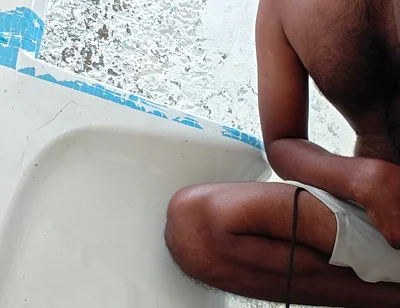 Washing the Bathroom in Xhard Village