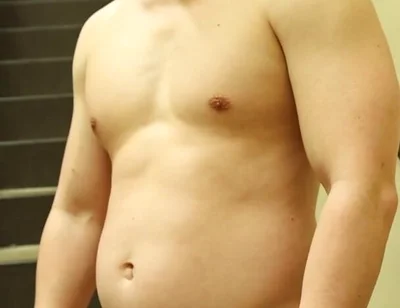 Flexing by the Stairs at the Gym