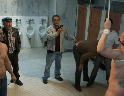 The Wrestler Gets Gang Banged by a Horny Crowd in a Public Restroom for Losing His Match.