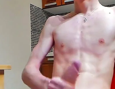 A young beautiful gay twink fucks a vibrator