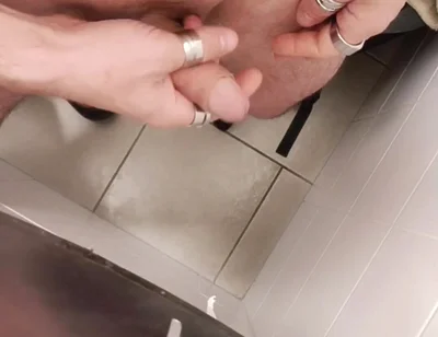 Jerking off a Cock in a Public Toilet