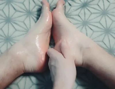 Guy Gently Massages His Feet with Oil