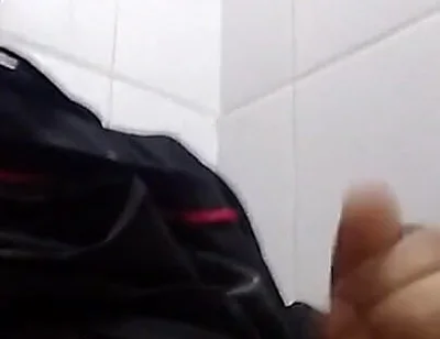 Man Sits in the Bathroom