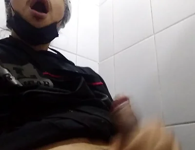 Man Sits in the Bathroom